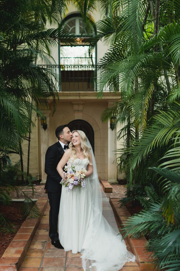 Couple posing for a photographer at Villa Woodbine in Miami, Florida 